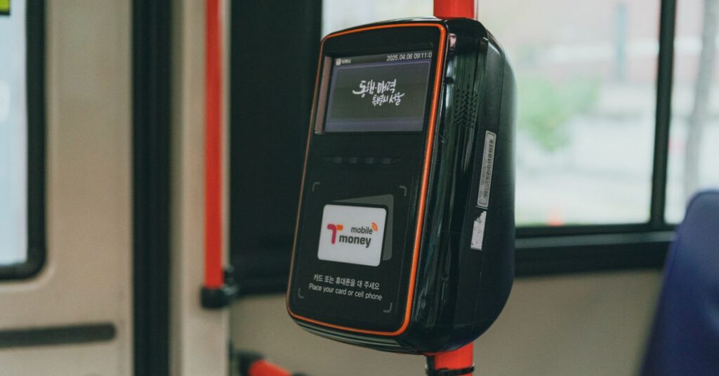 Close-up of a public transportation payment machine inside a bus in Seoul, South Korea.